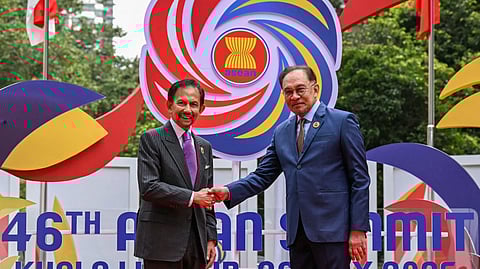 FILE PHOTO: Malaysia's Prime Minister Anwar Ibrahim greets Brunei's Sultan Hassanal Bolkiah before the plenary session at the 46th Association of Southeast Asian Nations (ASEAN) Summit in Kuala Lumpur on May 26, 2025. 