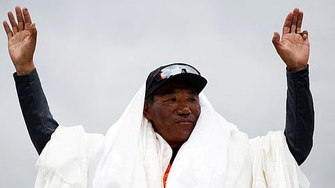 FILE PHOTO: Kami Rita Sherpa, 53, a Nepali mountaineer, waves towards the media personnel upon his arrival after climbing Mount Everest for the 28th time, creating a new record for the most summits of the world’s highest mountain, in Kathmandu, Nepal May 25, 2023. 