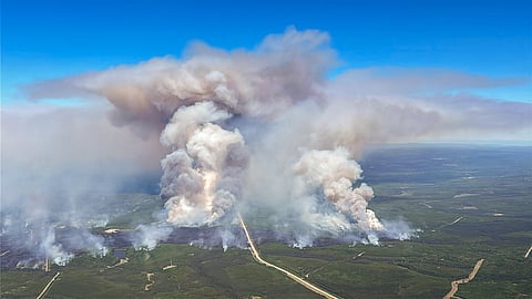 FILE PHOTO: Smoke rises from Edith Lake wildfire SWF076, which forced the evacuation of the nearby town of Swan Hills, Alberta, Canada in an aerial photograph May 28, 2025. 