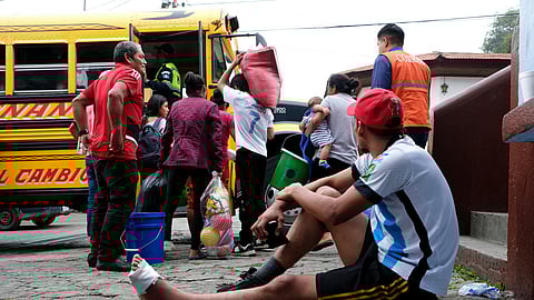 Residents of a community near Volcan de Fuego leave the municipal shelter after the volcano's activity decreased, in San Juan Alotenango, Guatemala June 6, 2025. 