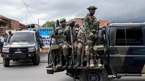 FILE PHOTO: FILE PHOTO: Members of the M23 rebel group mount their vehicles after the opening ceremony of Caisse Generale d'epargne du Congo in Goma, North Kivu province in the East of the Democratic Republic of Congo, April 7, 2025. 