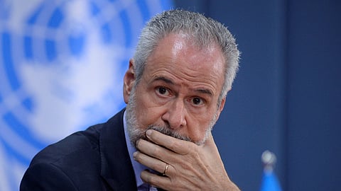 FILE PHOTO: COP30 President Ambassador Andre Correa do Lago listens to Simon Stiell, Secretary of UN Climate Change (UNFCCC), during an event in Brasilia, Brazil February 6, 2025. 