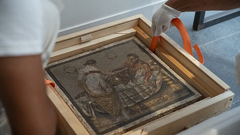 An ancient Roman mosaic depicting a half-naked couple is installed at the Pompeii Archaeological Park in Italy, in this handout released July 15, 2025. The artwork was recently returned to Pompeii, more than 80 years after it was stolen by a Nazi officer during World War II. 