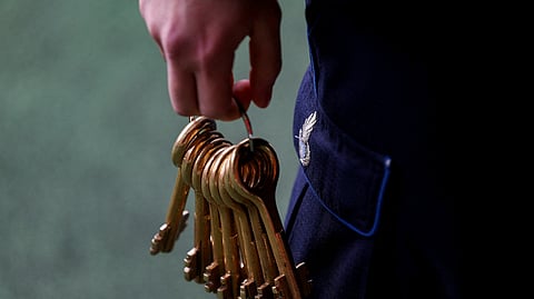 FILE PHOTO: A guard holds keys in an open space zone inside San Vittore prison in Milan, Italy, March 4, 2024. 