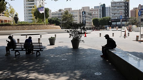 People sit in the shade during a heatwave in Nicosia, Cyprus July 23, 2025. 