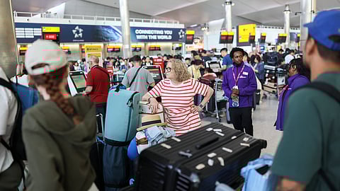 Passengers wait at Heathrow Airport, after radar failure led to the suspension of outbound flights across the UK, in Hounslow, London, Britain, July 30, 2025. 