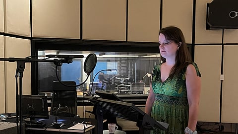 Synchronous speaker Bettina Zech stands in a dubbing studio in Munich, July 2, 2025. The rise of AI raises the question of whether voice dubbing actors will be needed in future, as actors’ voices can be translated into various languages, or voice databases can be created and used on infinite projects, barring legal considerations. Voice actors say dubbing is an art form, requiring them to give emotion and nuance to the lines. 