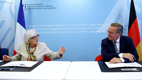 French Defence Minister Catherine Vautrin and German Defence Minister Boris Pistorius sign an implementation agreement for a satellite-based early warning system during a meeting of NATO Defence Ministers at the Alliance headquarters in Brussels, Belgium October 15, 2025. 