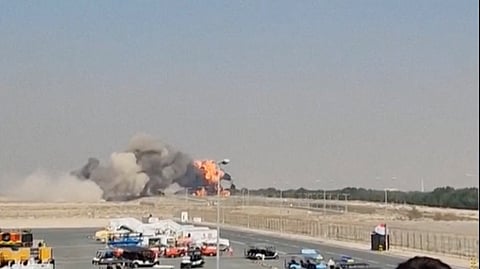 Smoke billows following a crash of Indian home-produced Tejas fighter jet, after it lost altitude and crashed during an aerial display at the Dubai Air Show, in Dubai, United Arab Emirates, November 21, 2025, in this screengrab obtained from an eyewitness video.
