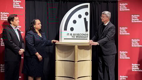Jon Wolfsthal, director of global risk at the Federation of American Scientists (FAS), Asha George, executive director of the Bipartisan Commission on Biodefense, and Steve Fetter, professor of public policy and former dean at the University of Maryland, reveal the location of the minute hand on its Doomsday Clock, indicating what world developments mean for the perceived likelihood of nuclear catastrophe, during a town-hall in Washington, D.C., U.S., January 23, 2026.