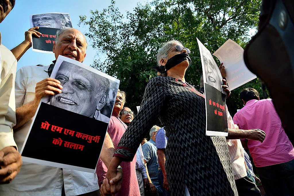 Writers and cultural activists protest the killing of writer MM Kalburgi and others in New Delhi; <i>Photo by Priyanka Parashar/Mint via Getty Images</i>