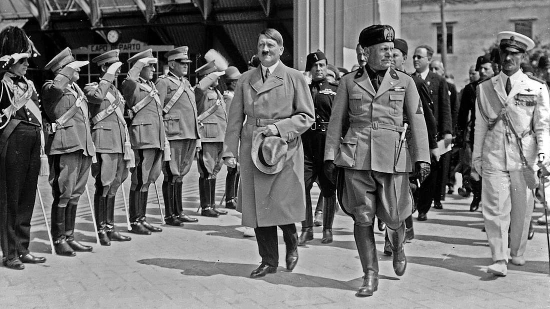 Adolf Hitler and <a href="http://encyclopedia.thefreedictionary.com/Benito+Mussolini">Benito Mussolini</a> during Hitler’s visit to <a href="http://encyclopedia.thefreedictionary.com/Venice">Venice</a> in June, 1934; <i>Wikimedia Commons</i>