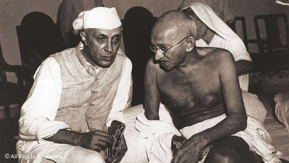 Mahatma Gandhi in conversation with Jawaharlal Nehru at the All India Congress Committee meeting in Bombay, 1946