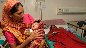 Is govt bluffing on universal
maternity benefits?