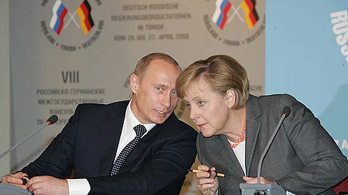 Photo courtesy: <a href="https://commons.wikimedia.org/wiki/File:Putin_merkel.jpg">Wikimedia Commons</a>