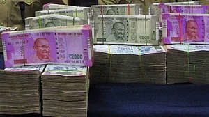 Rupee slides further; hits fresh low of 71