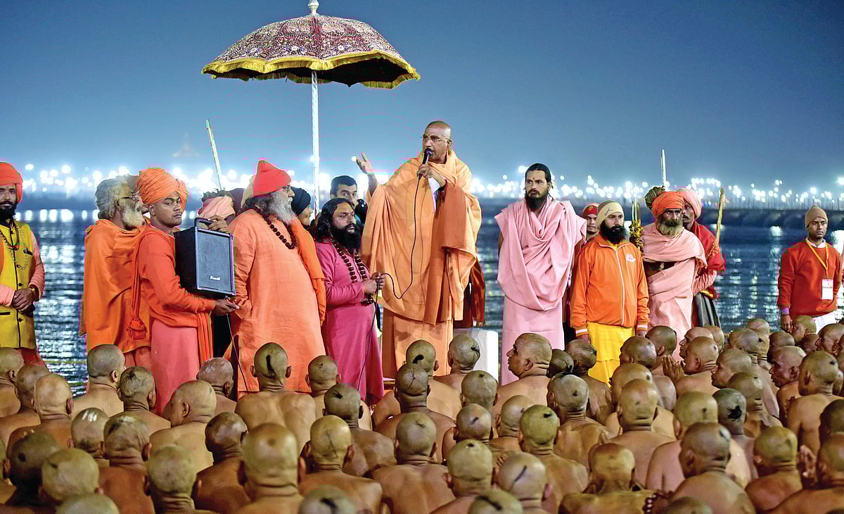 Newly-initiated Naga Sadhus perform rituals at the bank of river Ganga during the Kumbh Mela festival, on February 6, 2019 in Prayagraj, India 