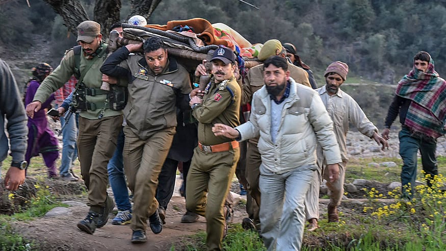 Police officials and locals carry an injured for treatment to a hospital after firing and mortar shelling by the Pakistani Army along the LoC in Krishna Ghati  sector of  Poonch district in Jammu and Kashmir.