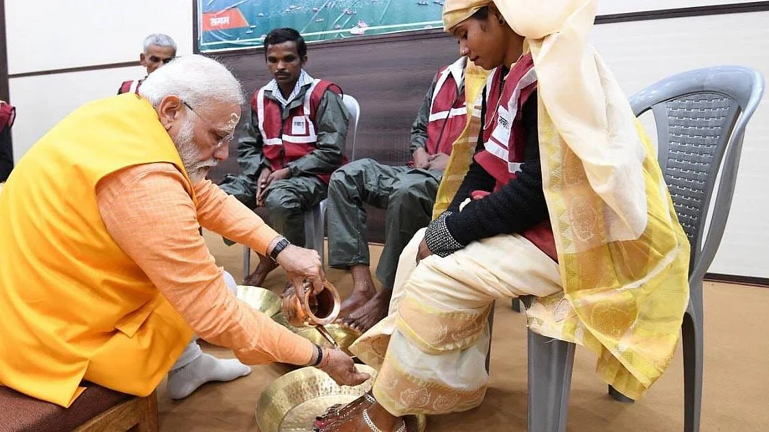 Modi’s stunt of washing the feet of sanitary workers points to glorification of caste system