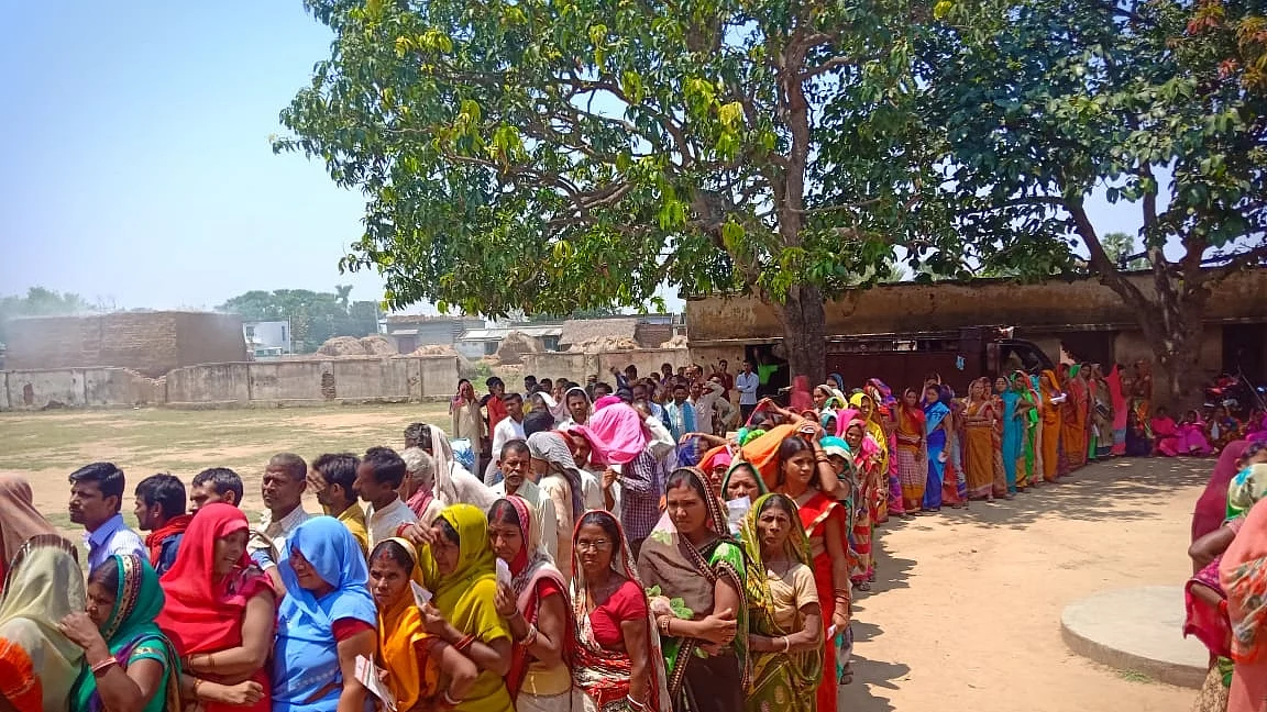 People wait in multiple queues to cast their votes for the second phase of 2019 Lok Sabha elections in Bihar’s Banka (IANS Photo)