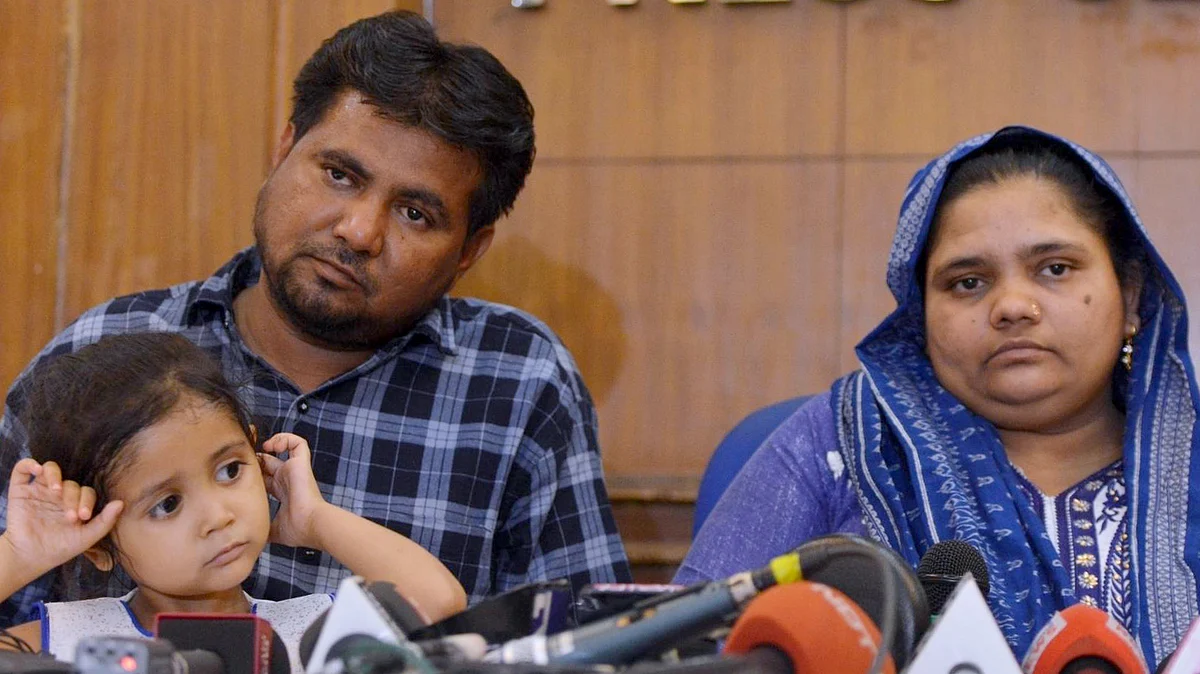 Gujarat gang-rape survivor Bilkis Yakub Rasool Bano with her husband and daughter, during a press conference in New Delhi. Bano was gang-raped at the age of twenty-one in the post-Godhra riots in 2002. 