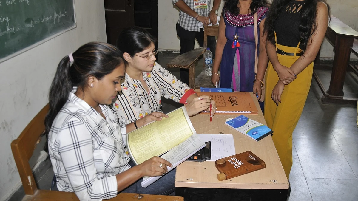 Students filling college admission forms (representational image).&nbsp;