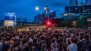 Silent sit-in escalates as Hong Kong protesters gather outside parliament and police HQ after end of ultimatum