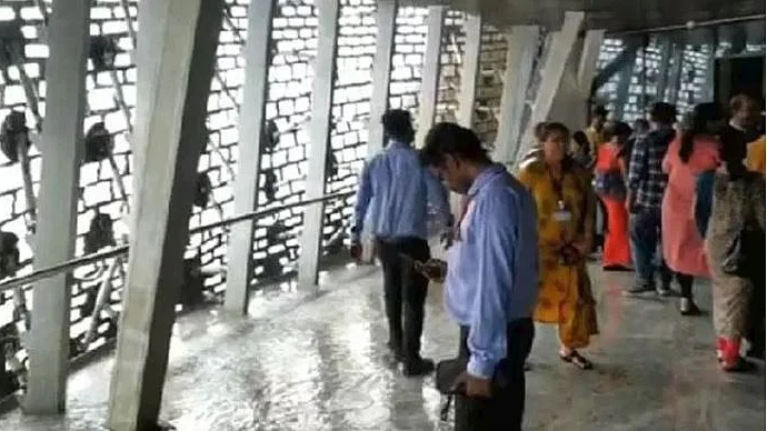 WATCH| Visitors walk through puddles as water drips from ceiling at  Statue of Unity