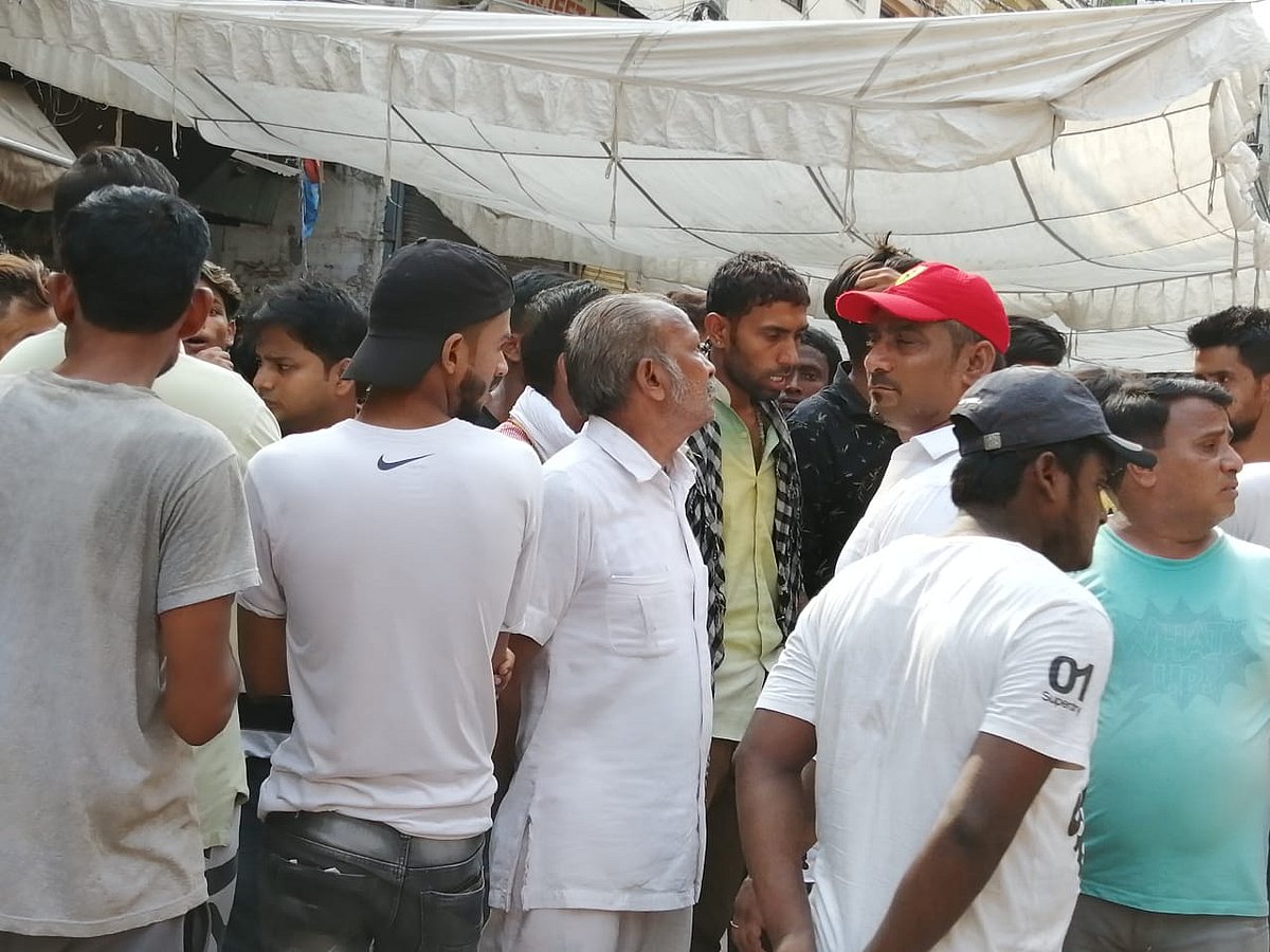 Bajrang Dal activists under an awning near the temple 