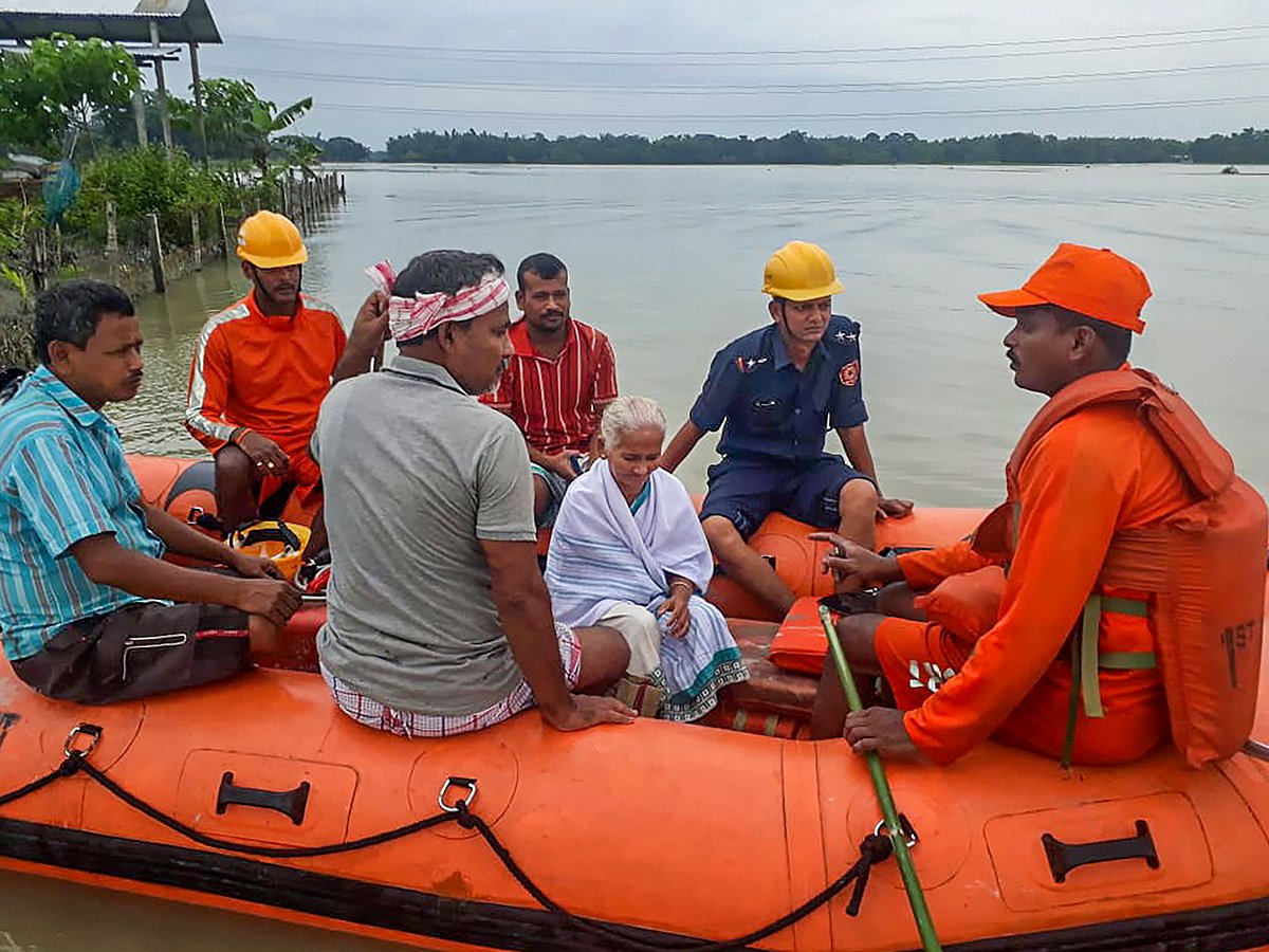 NDRF personnel conduct evacuation operation from the flood affected area of Baksa district in Assam