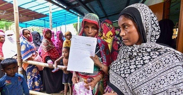 Residents queue up to submit documents during the Assam NRC exercise (photo: National Herald archives)