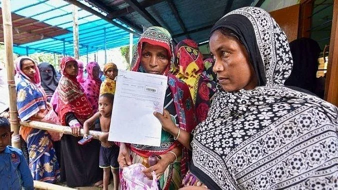 A file photo of people thronging an NRC verification centre in Assam with their documents to prove their citizenship.