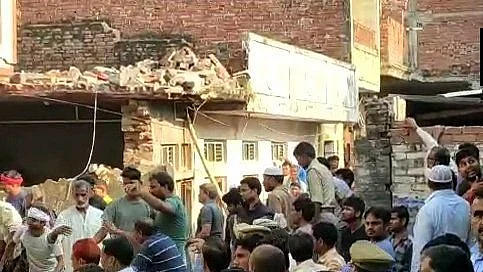 12 killed after a two-storey building collapsed following a cylinder blast in Mau, UP