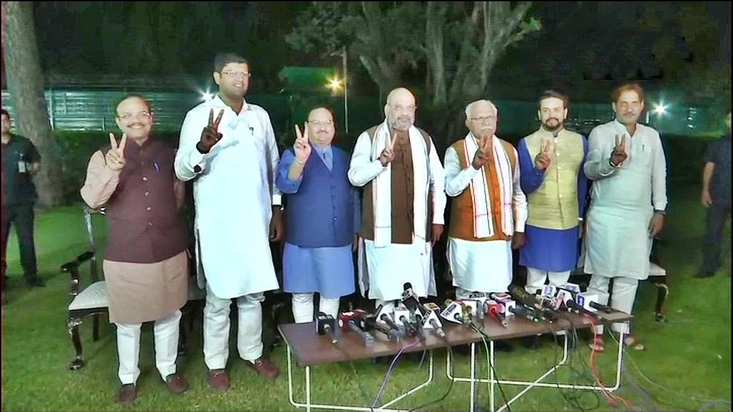 Amit Shah and Manohar lal Khattar with JJP leader (IANS Photo)