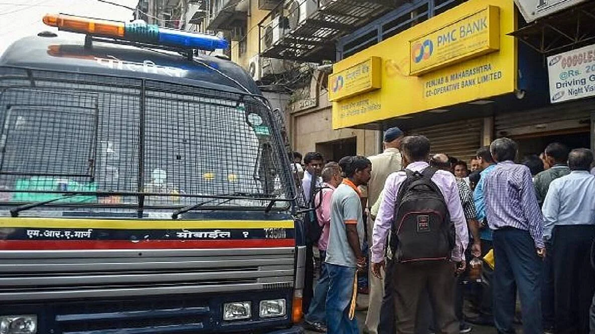 Hapless customers throng a branch of the PMC Bank in Mumbai (PTI photo)