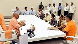 UP Chief Minister Yogi Adityanath meeting the family of slain Hindutva leader Kamlesh Tiwari in Lucknow on Sunday.