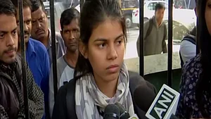 Woman protesting outside Parliament alleges police brutality