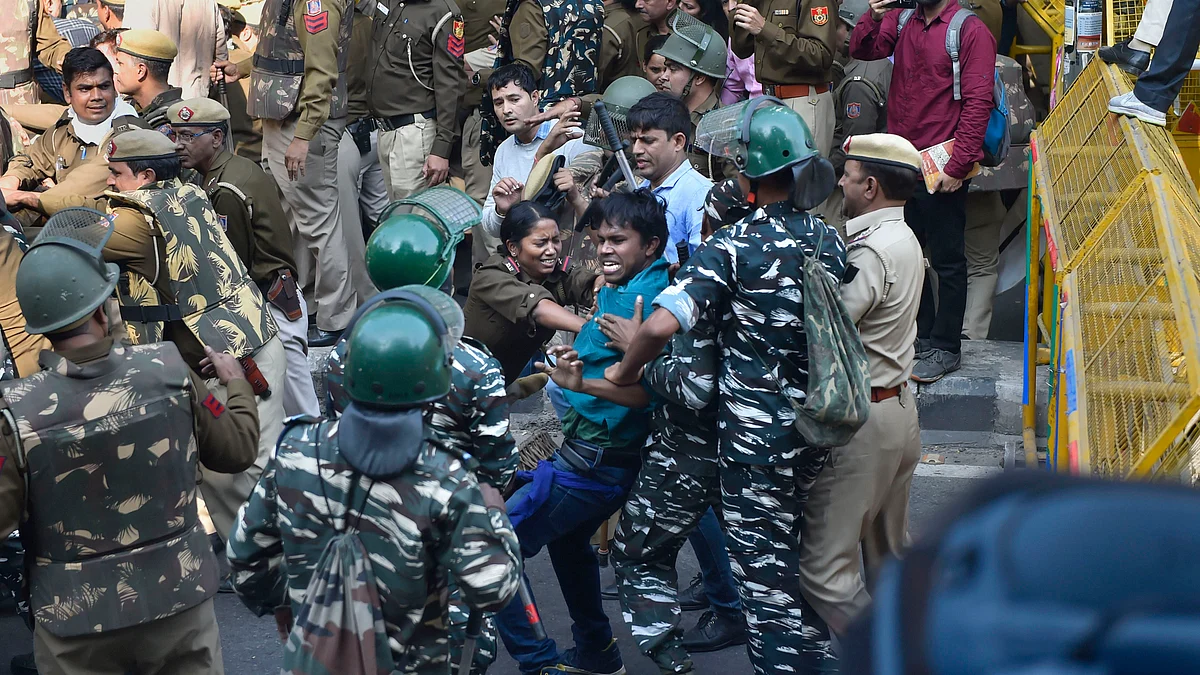 Police stopping JNU students from crossing the barricades during a protest march towards Parliament in New Delhi, Monday, Nov 18, 2019. (PTI photo)