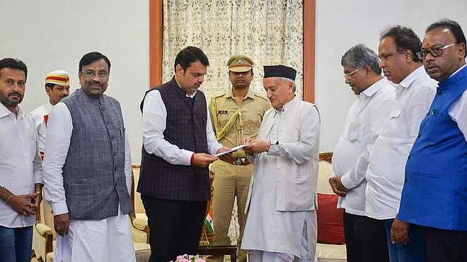 Maharashtra acting Chief Minister Devendra Fadnavis (left) handing over his resignation to state Governor Bhagat Singh Koshiyari. (file photo).