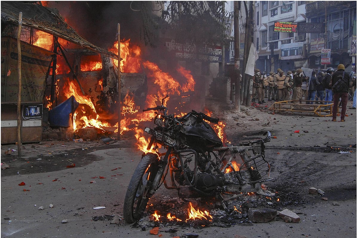 A vehicle torched allegedly by protesters during a demonstration against the Citizenship Amendment Act in Kanpur, Uttar Pradesh, on Saturday, Dec 21, 2019. (PTI photo)
