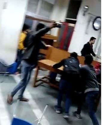 Panic stricken students inside Jamia library scramble to take cover as glass shards fly around due to teargas shells firing by Delhi police from outside.
