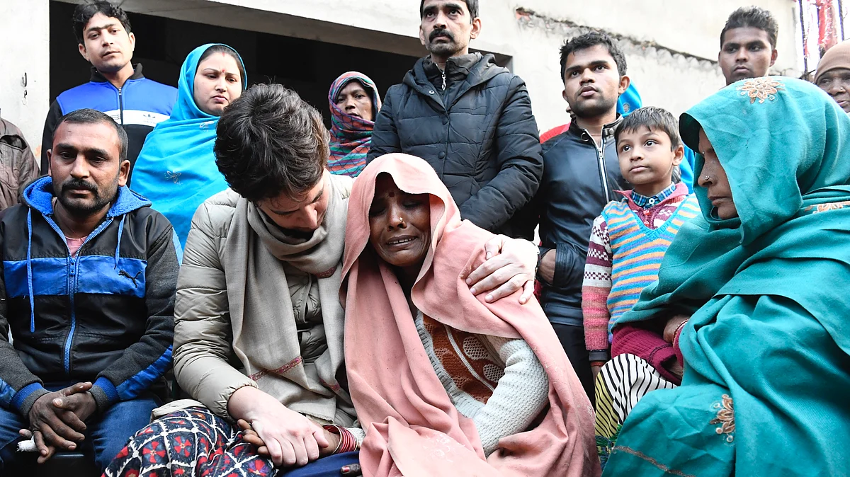Priyanka Gandhi consoles the mother of Suleman who was allegedly killed in police firing during anti-CAA protest on Friday, in UP’s Nehtaur, Sunday Dec 22, 2019. (Photo courtesy: AICC)