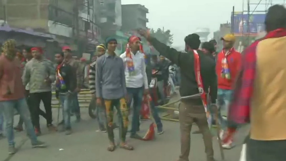 Vikassheel Insaan Party workers break barricades during demonstration in Patna against the CAA