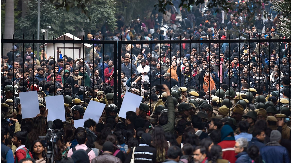 Students stage a protest at main gate of JNU over Sunday’s violence on Monday, Jan 6, 2020. (PTI photo)