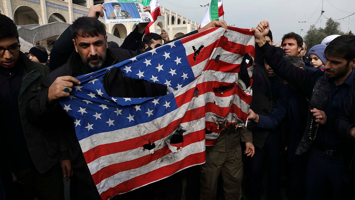 Protesters burn a U.S. flag during a demonstration over the U.S. airstrike in Iraq that killed Iranian Revolutionary Guard Gen. Qassem Soleimani, in Tehran (PTI)