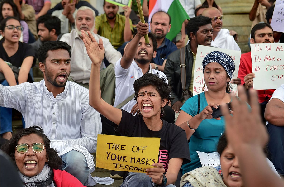 Students display placards and raise slogans during a demostration against the violence at Delhi’s JNU, in Bengaluru, Monday, Jan. 6, 2020. (PTI Photo)