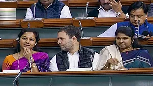LoP Lok Sabha Congress MP Rahul Gandhi with NCP MP Supriya Sule (L) and DMK’s Kanimozhi in the Lok Sabha
