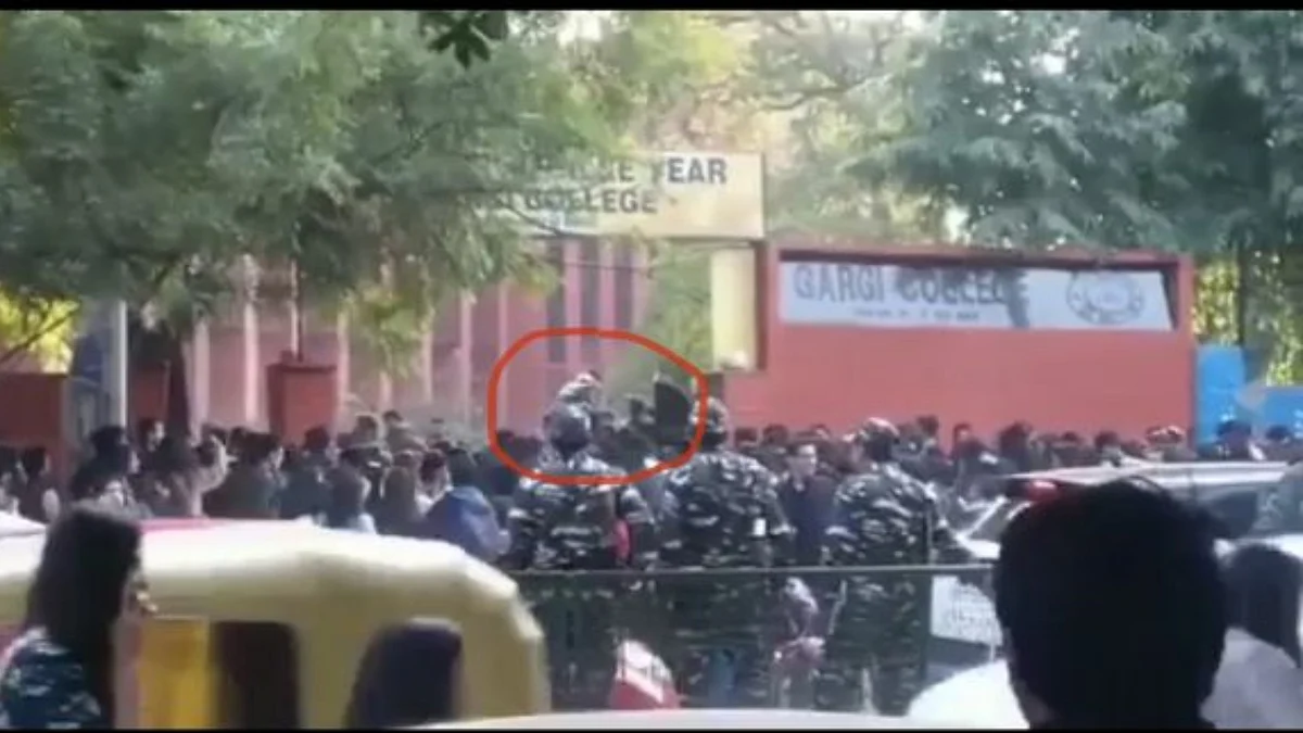 Video grab showing men jumping across the closed gate in front of securities personnel (Photo courtesy- social media)