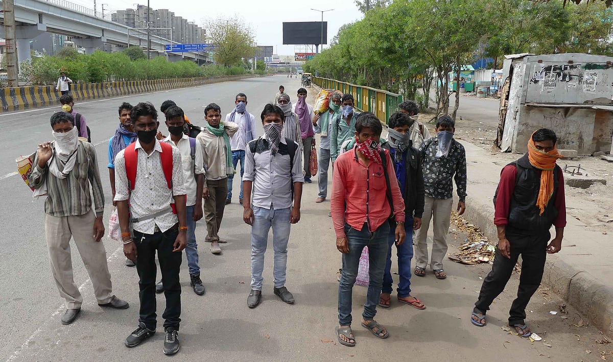 Masons and labourers walking back on foot to their respective villages which are 100s kilometers away in Balia, UP and Bihar. He waited at construction site for payment&nbsp; but owner did not turn up