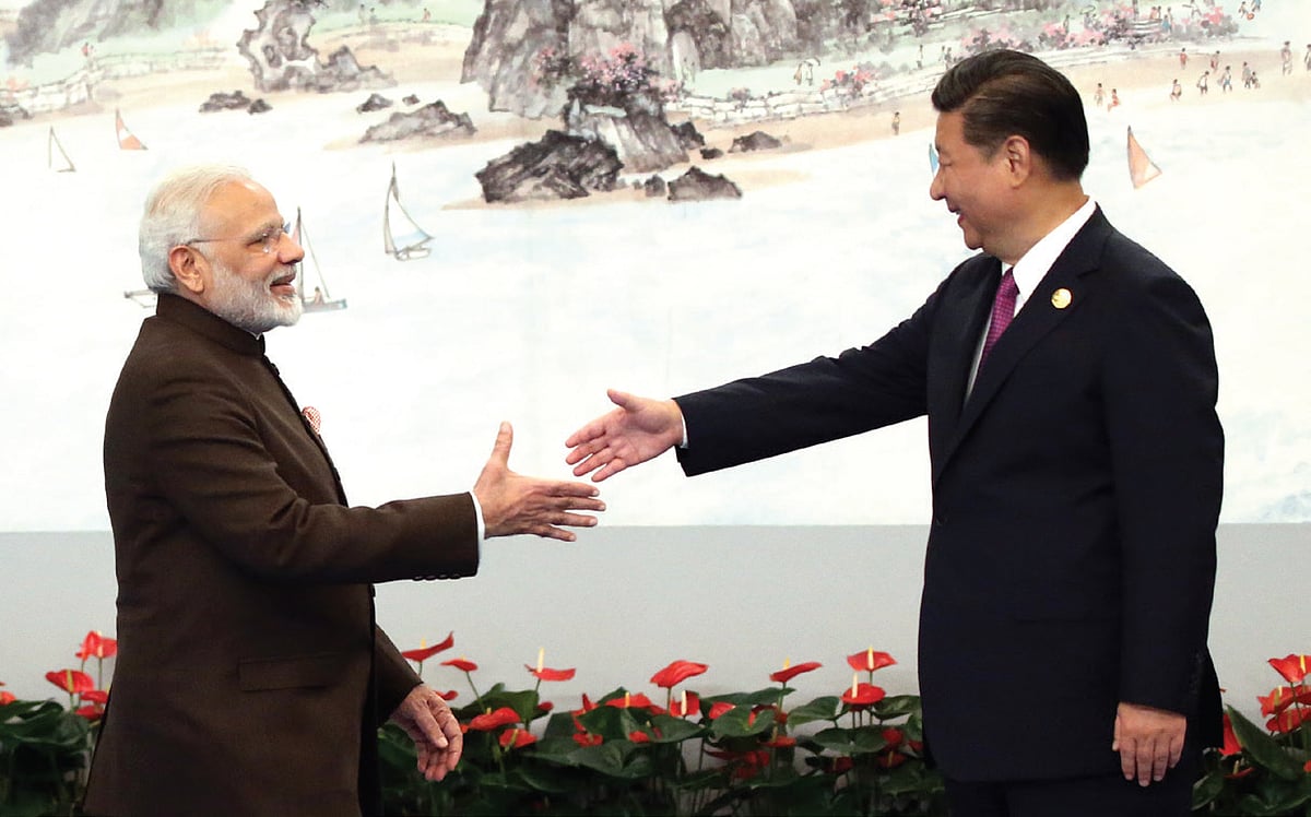 <b>Xiamen, China, September 4, 2017: </b>Prime Minister Narendra Modi shakes hands with Chinese President Xi Jinping prior to the dinner on September 4, 2017 in Xiamen, China